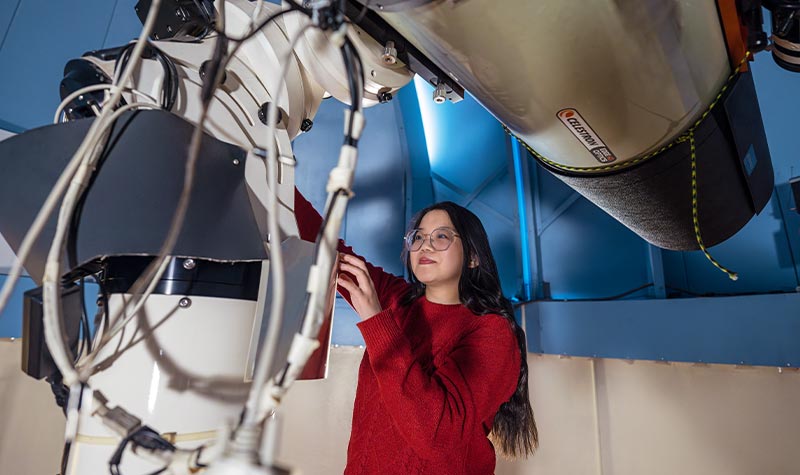 a student learning how to use specialty equipment