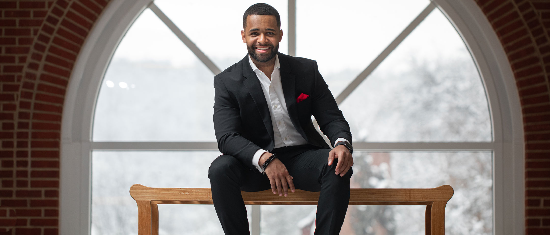 a business student sitting on a bench