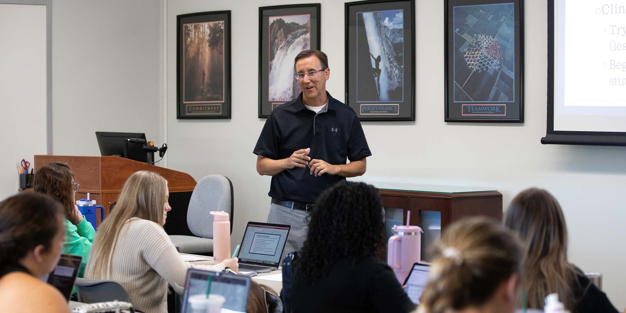 A professor teaching in a classroom