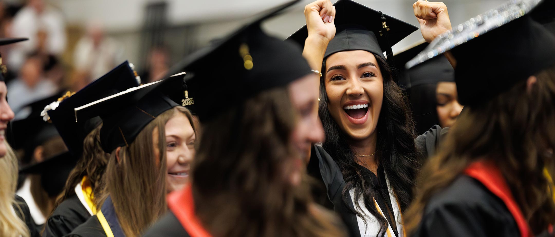 Students cheering at graduation