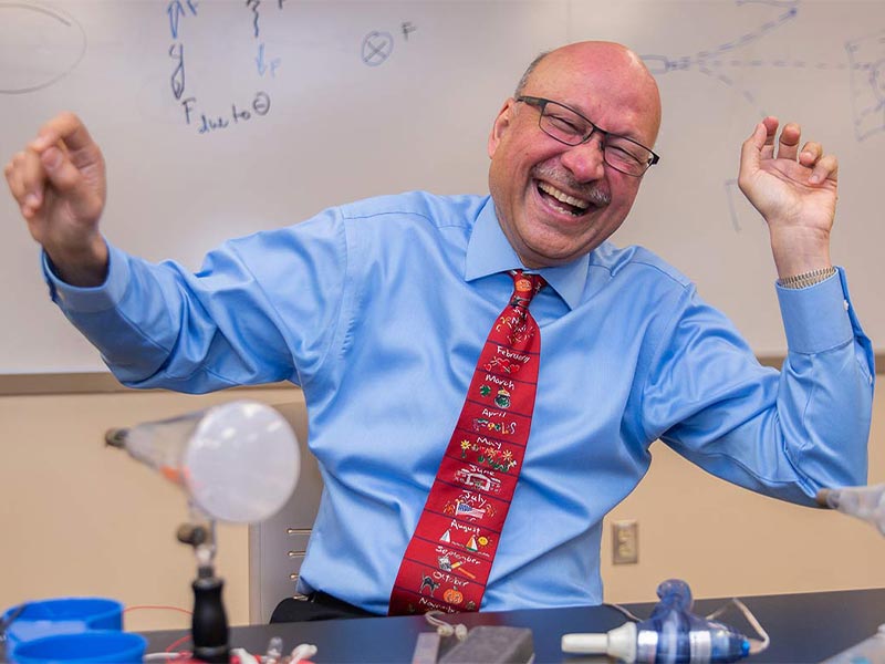 Dr. Karim Hossain enjoying teaching Physics