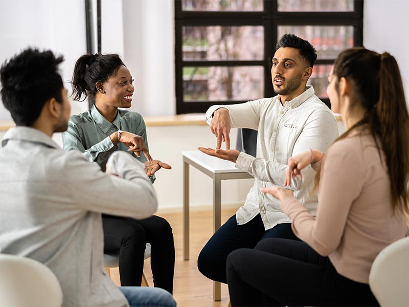 Adult students learning sign language