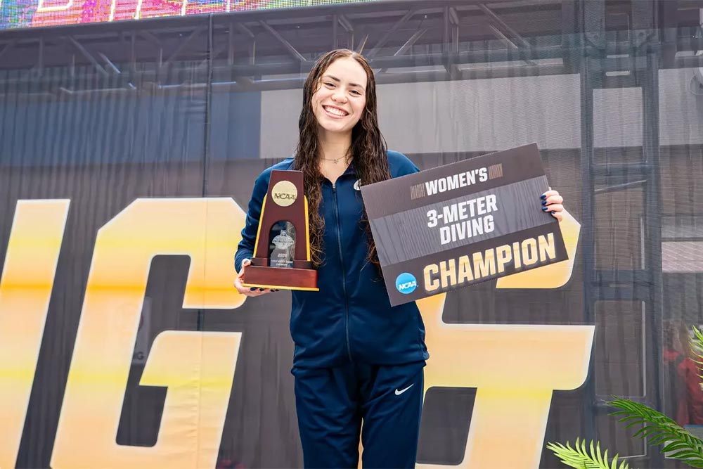 PennWest Clarion diver Luna Castellanos and coach Heath Calhoun following national award recognition at the NCAA Division II Championships.