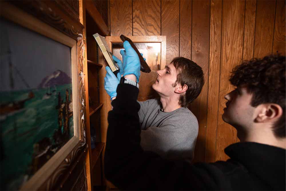 PennWest criminal justice students processing evidence and practicing investigative skills in the Crime House training environment.