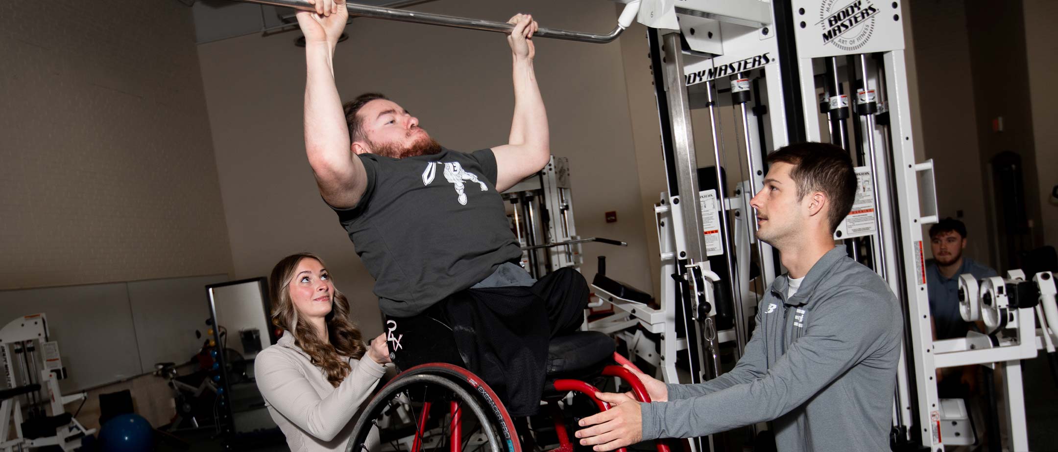A student doing a pull up
