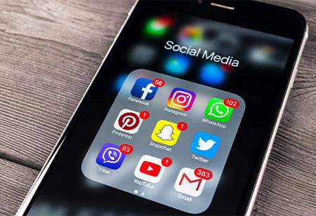 A cellphone showing many social media icons