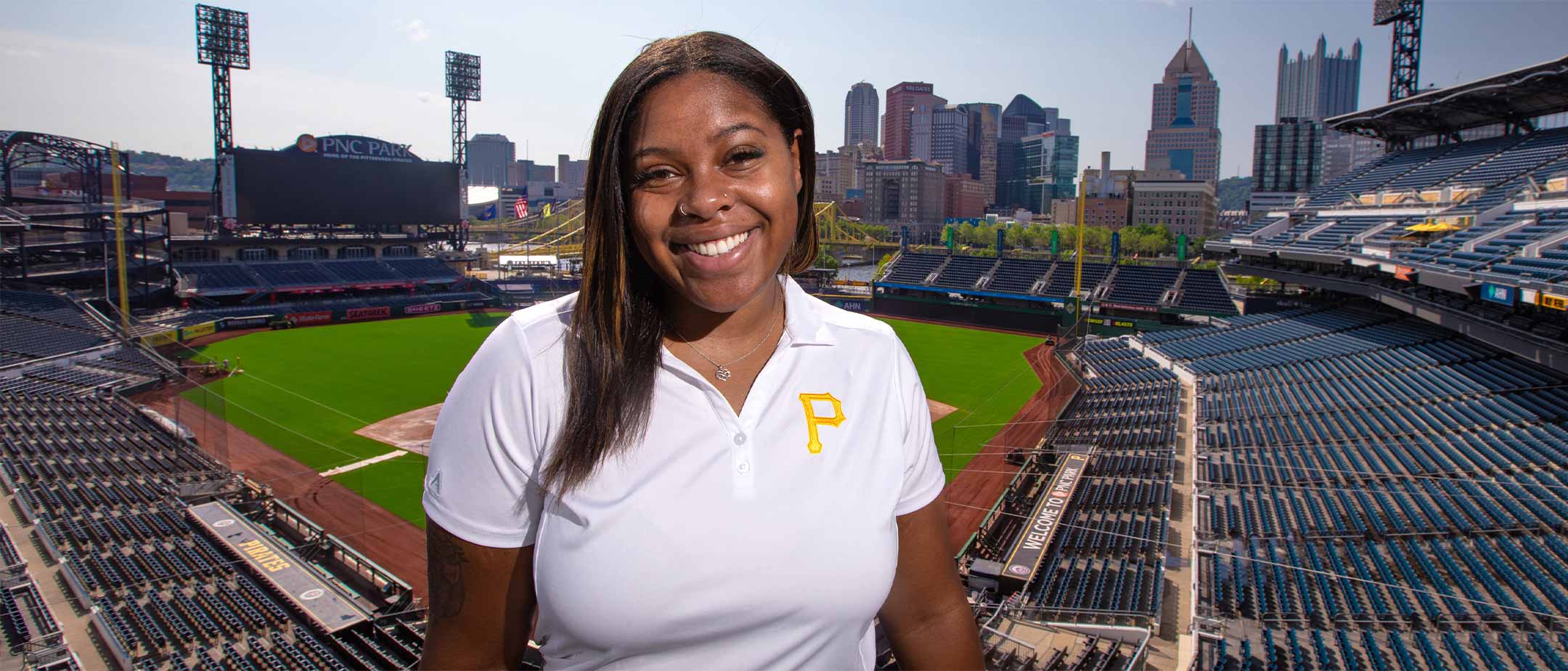 A student standing inside PNC Park