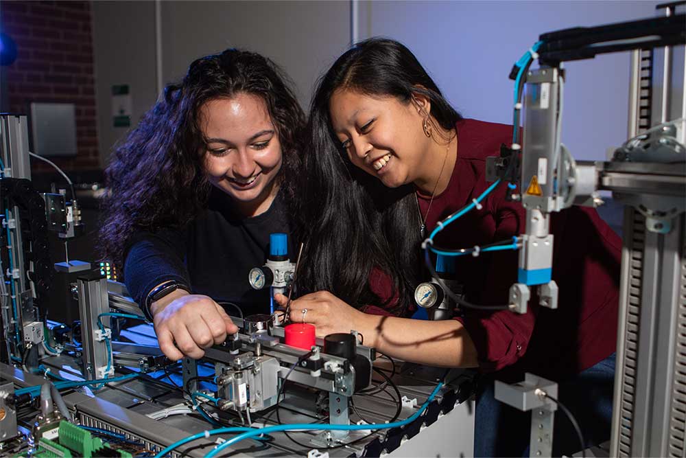 PennWest University students gain hands-on career experience working with engineering equipment in a laboratory.