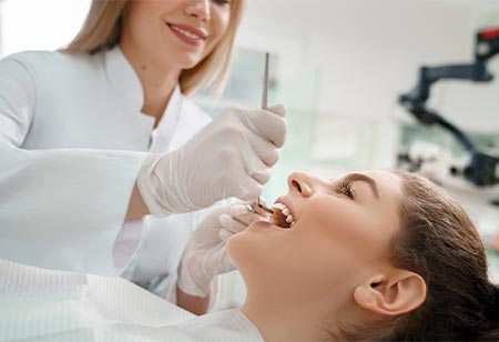 A dentist examining a patient's mouth