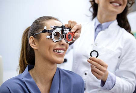 A optometrist giving an eye exam