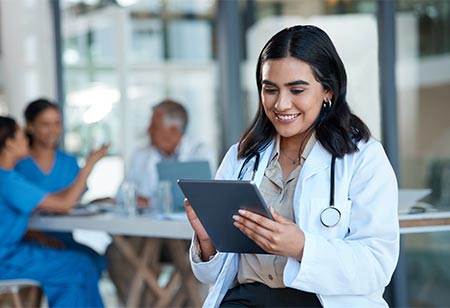 A physician assistant reviewing a patient chart