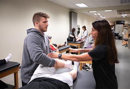 A student learning about physical therapy