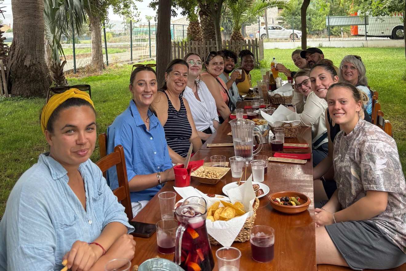 Students and hosts enjoy outdoor meal in Spain