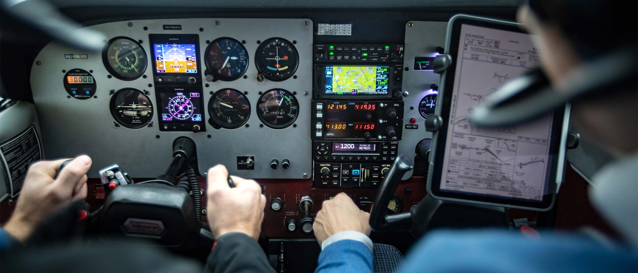 Aeronautic students in the cockpit of a plane