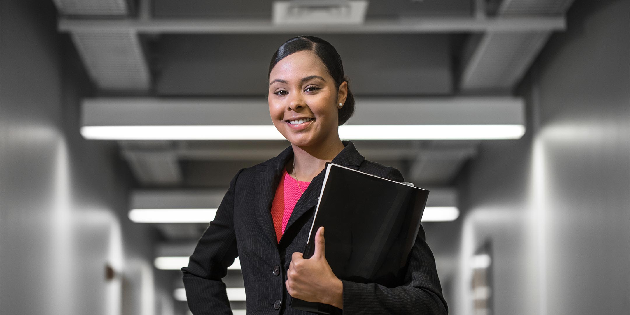 a business person holding a portfolio