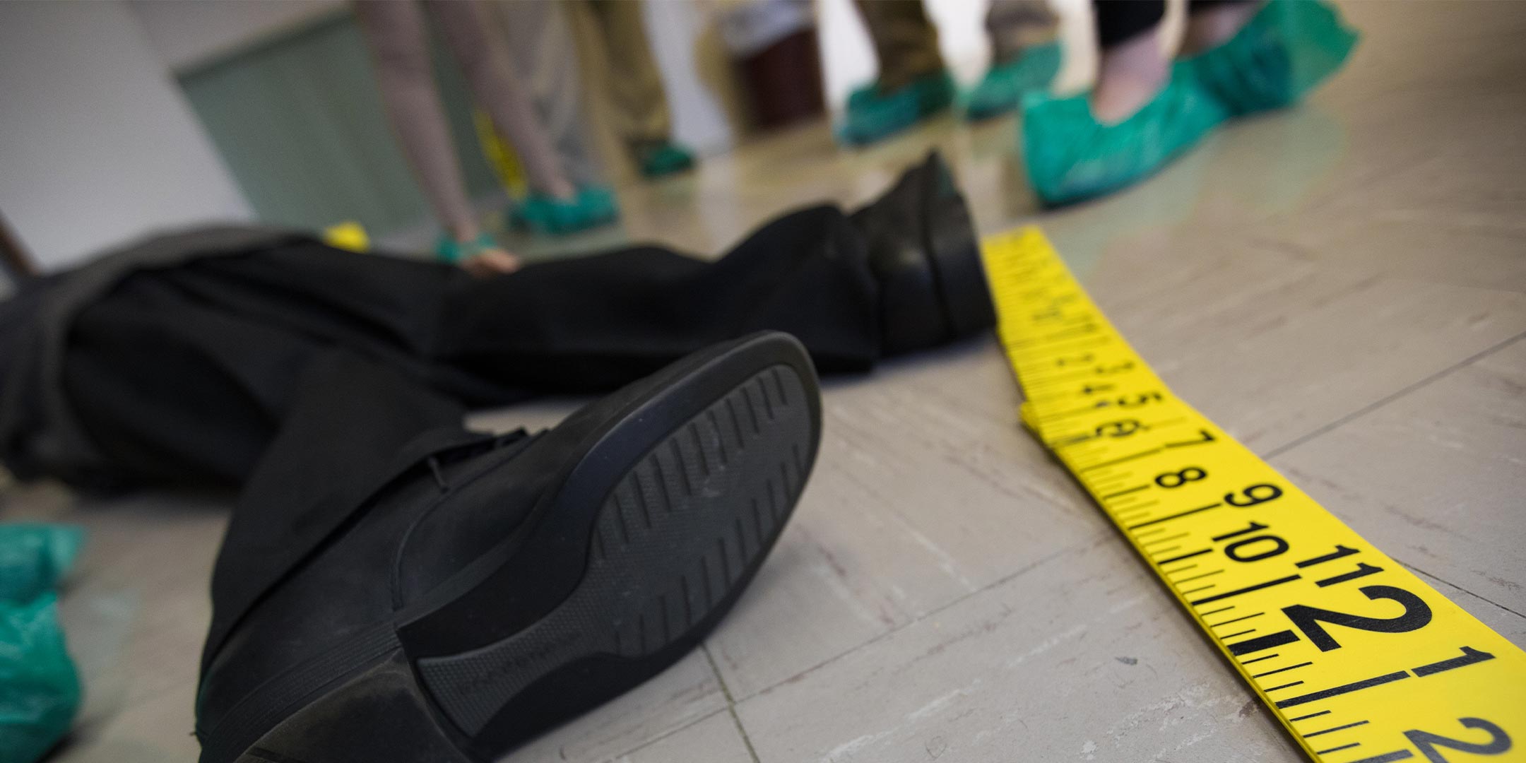 forensic science students investigating a mock crime scene