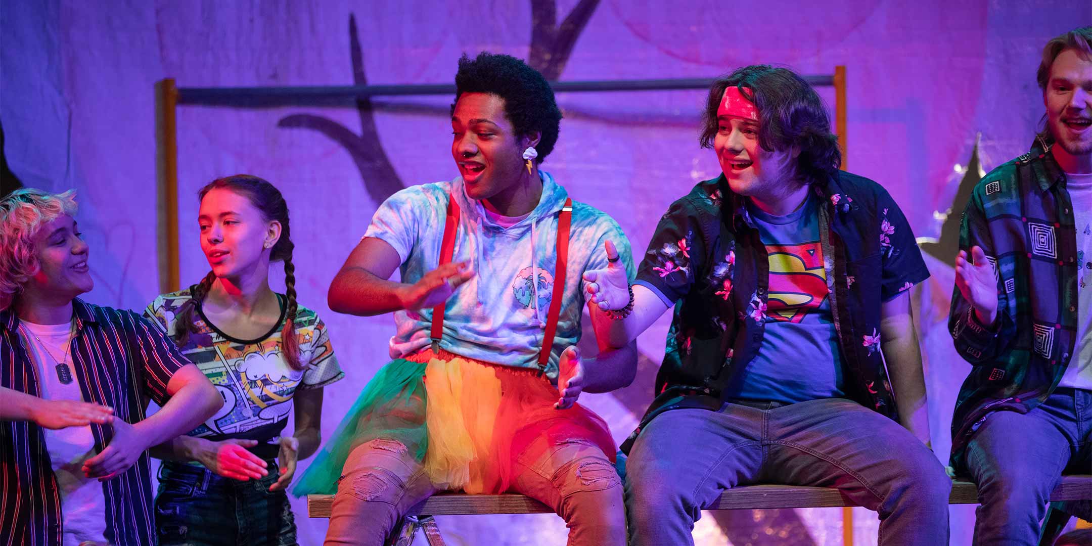 performing arts students acting in a play