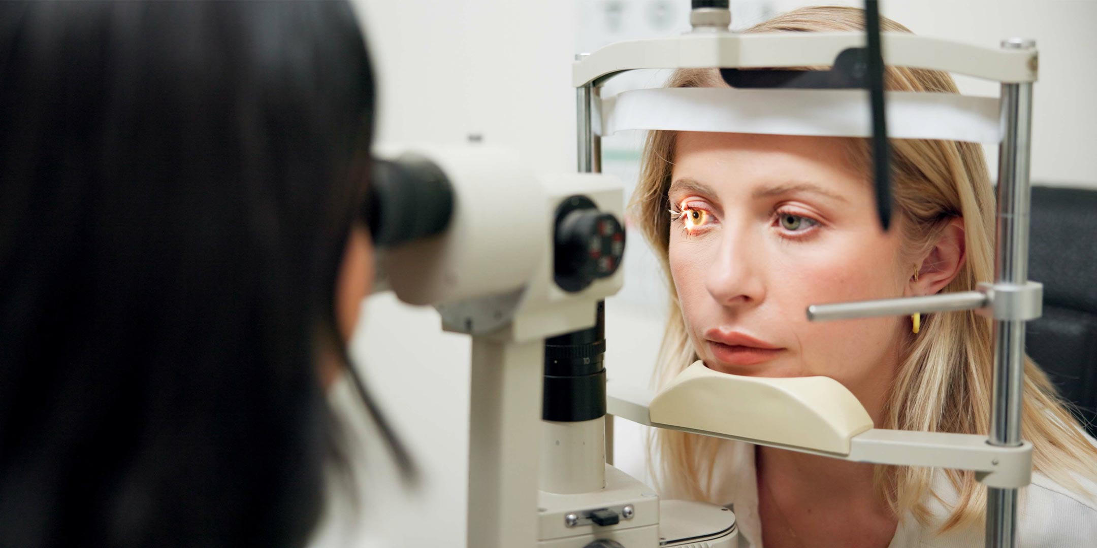 an optometrist administering an eye exam