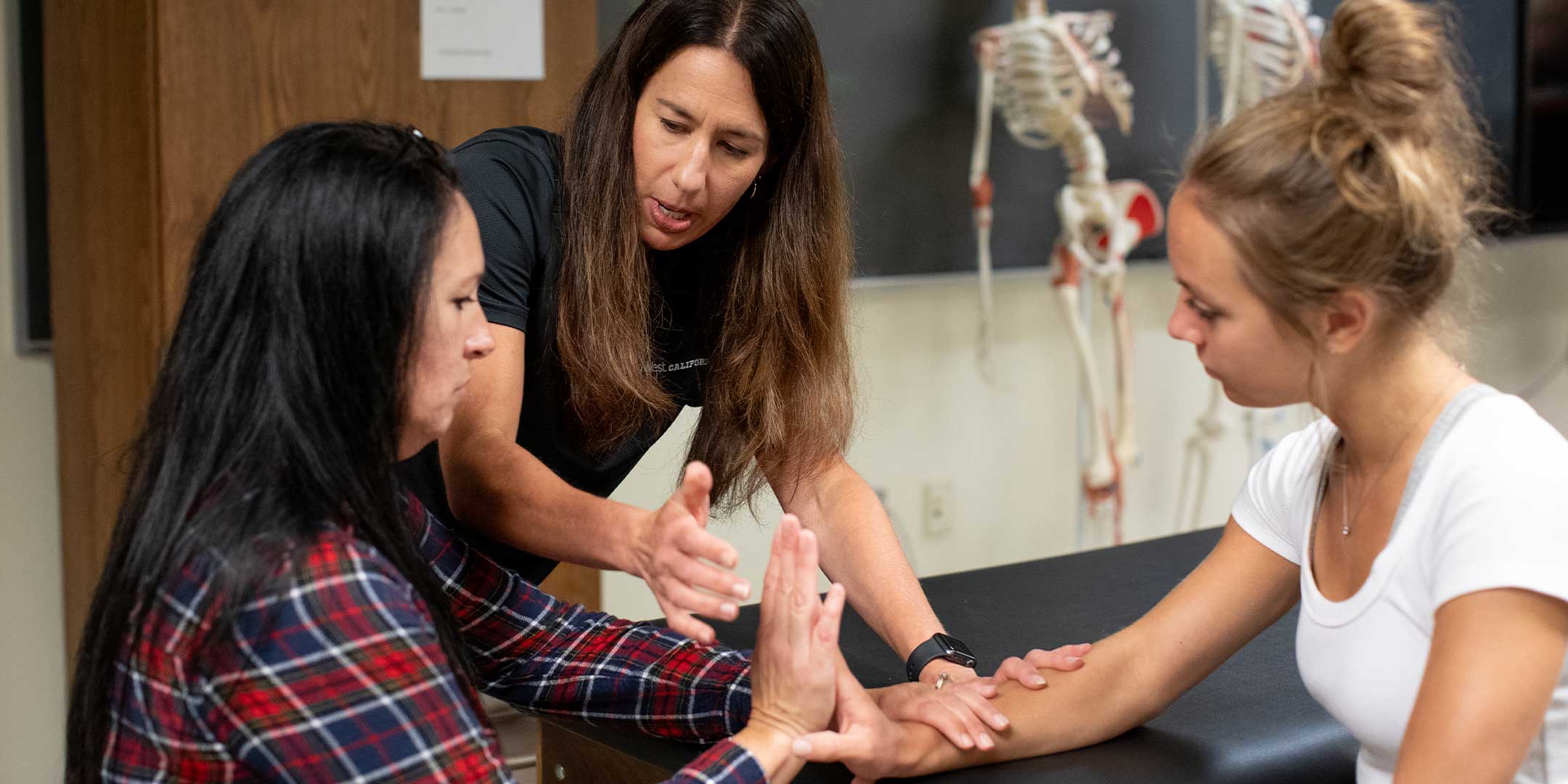 pre-physical therapy students learning proper techniques in a classroom