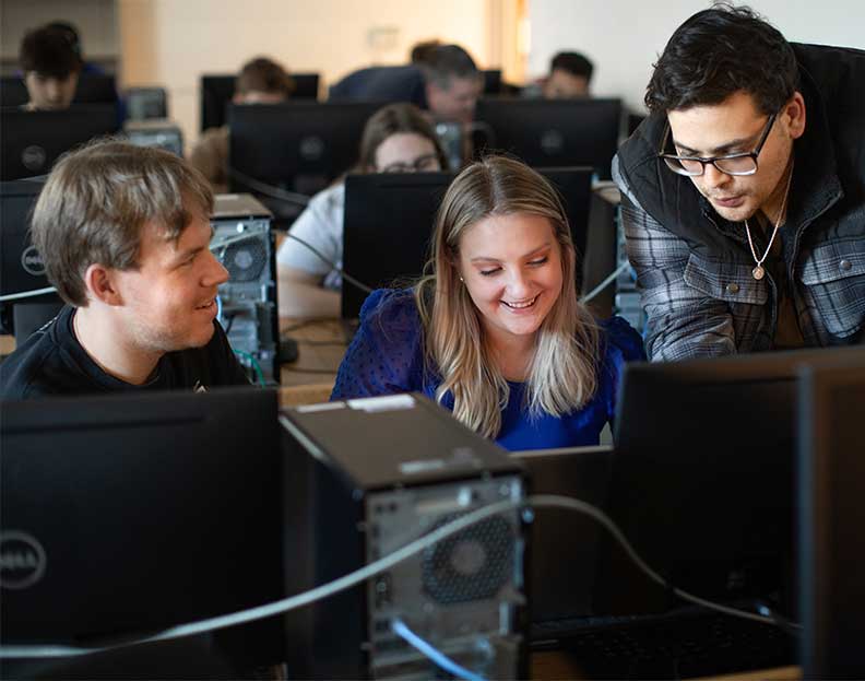computer information systems students working in a computer lab