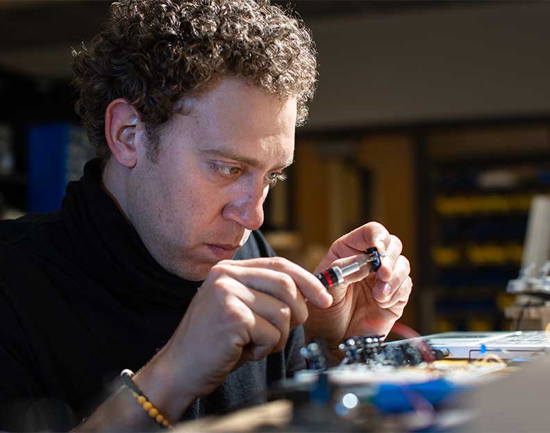 a electrical engineering technology student testing a diode