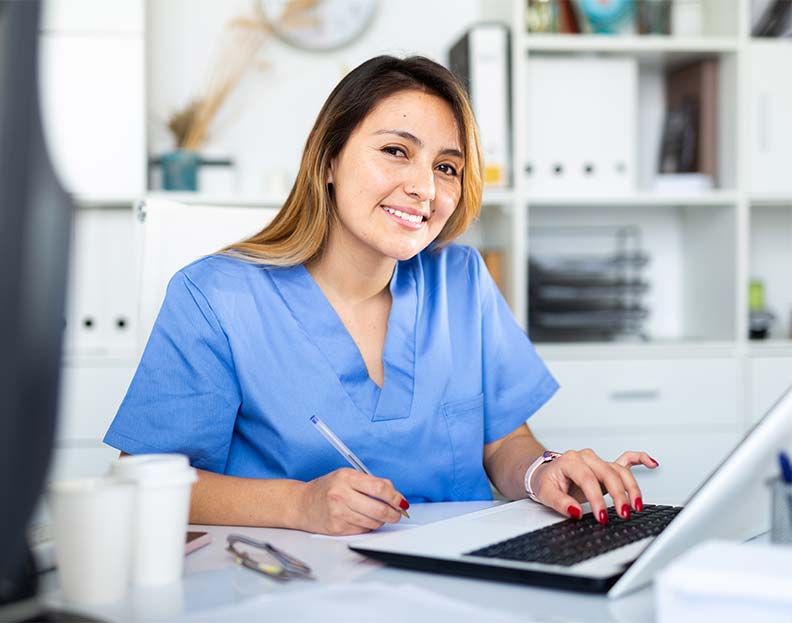 a physician assistant entering patient information into their digital chart