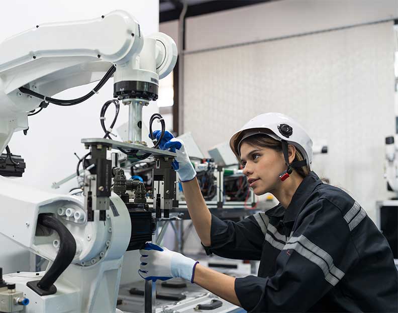 a robotics engineer adjusting some machinery