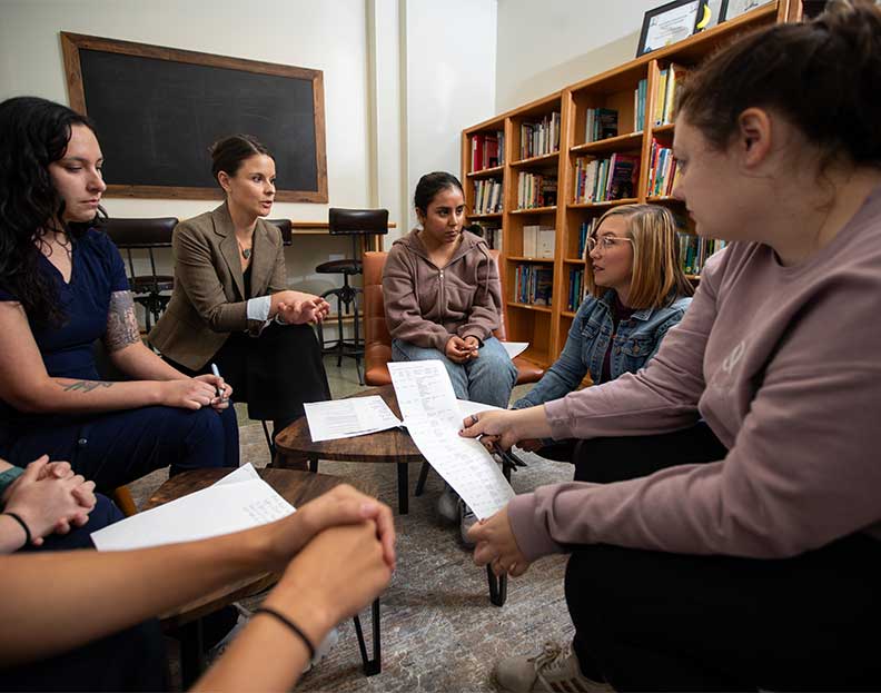 speech-language pathology students discussing different techniques