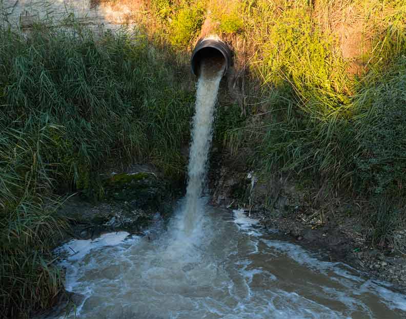 water from a wastewater treatment plant flowing from a discharge pipe