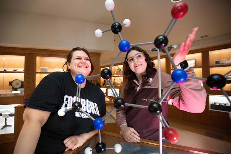 Students looking at a model