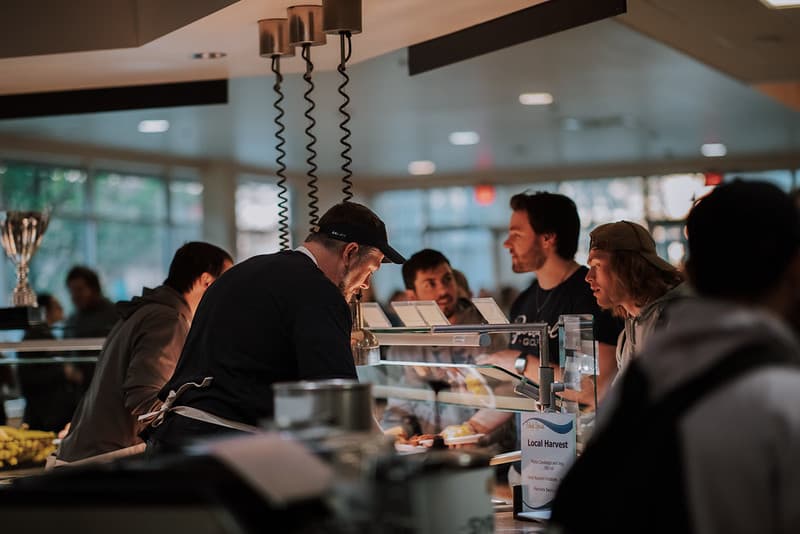 PennWest Clarion student grabbing food in dining facility placeholder image.