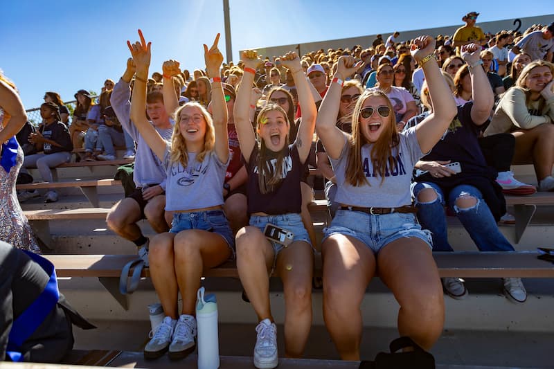 Students gather at a PennWest Clarion football game.