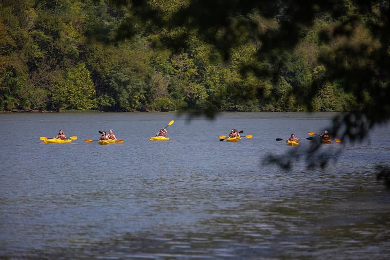 PennWest California students kayak down the river near campus.