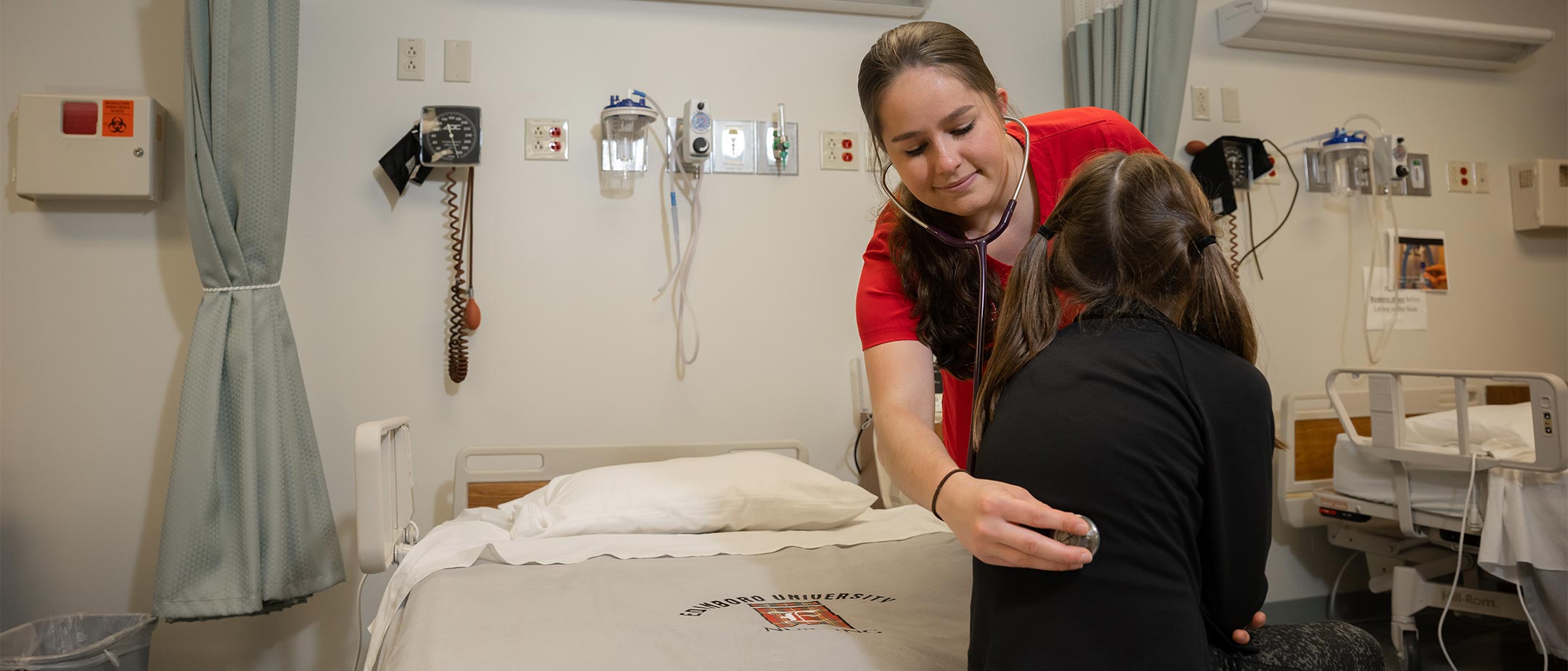 A nursing student in a simulation lab