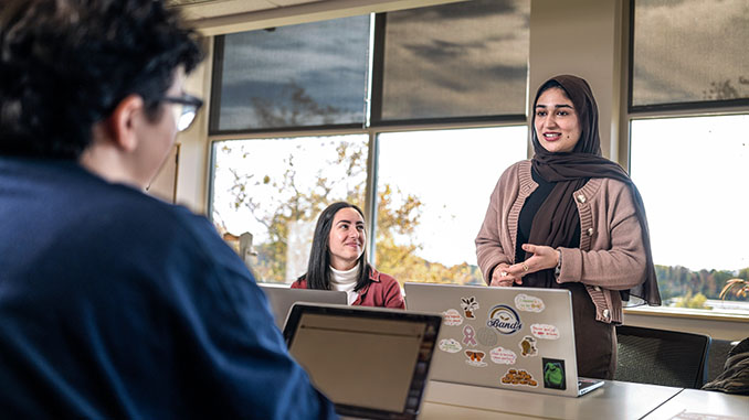 Student Presenting her to her classmates