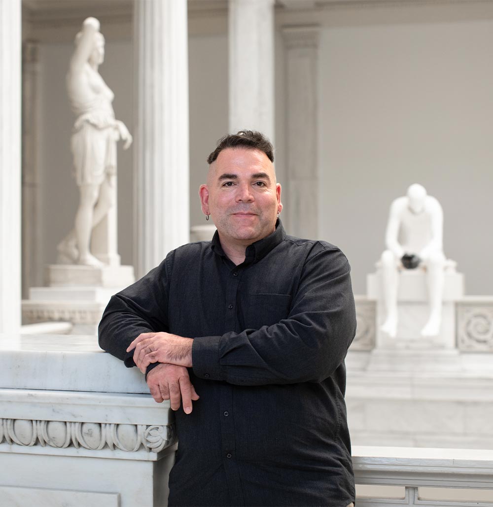 An adult student working on a laptop