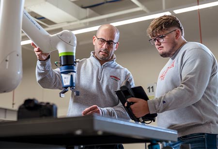 a management student working with a professor