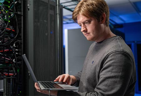 a student working on a laptop