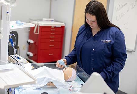 A nursing student working in a lab