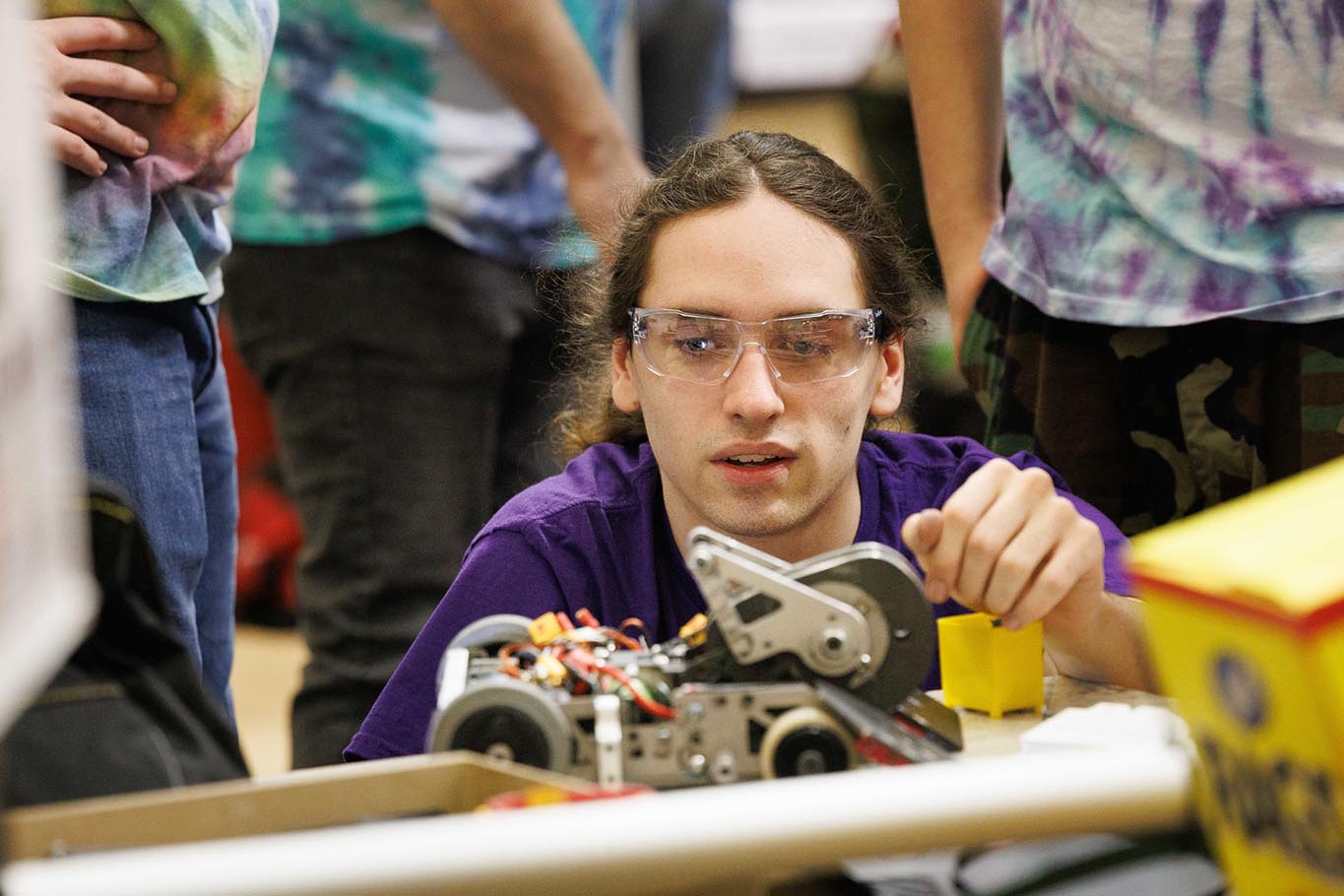 student works on a botsiq robot