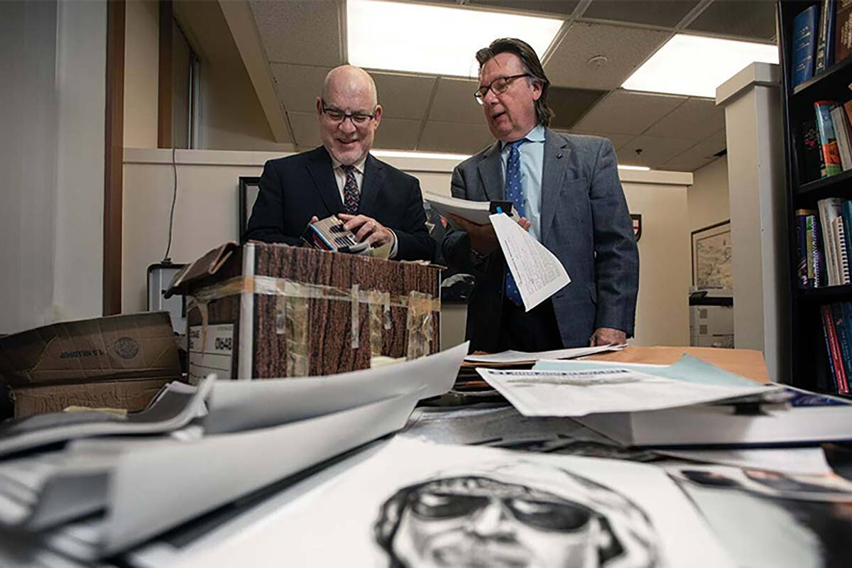 Dr. John Cencich, a retired law enforcement official and former war crimes investigator alongside James R. Fitzgerald, a retired FBI Supervisory Special Agent review case files.