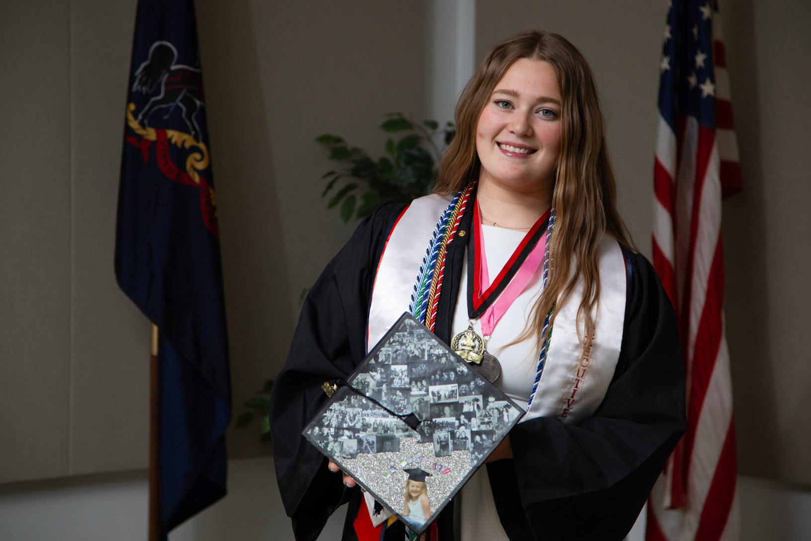 PennWest California grad Caitlyn Egan poses with her graduation cap prior to delivering the student commencement speech on May 9, 2026.