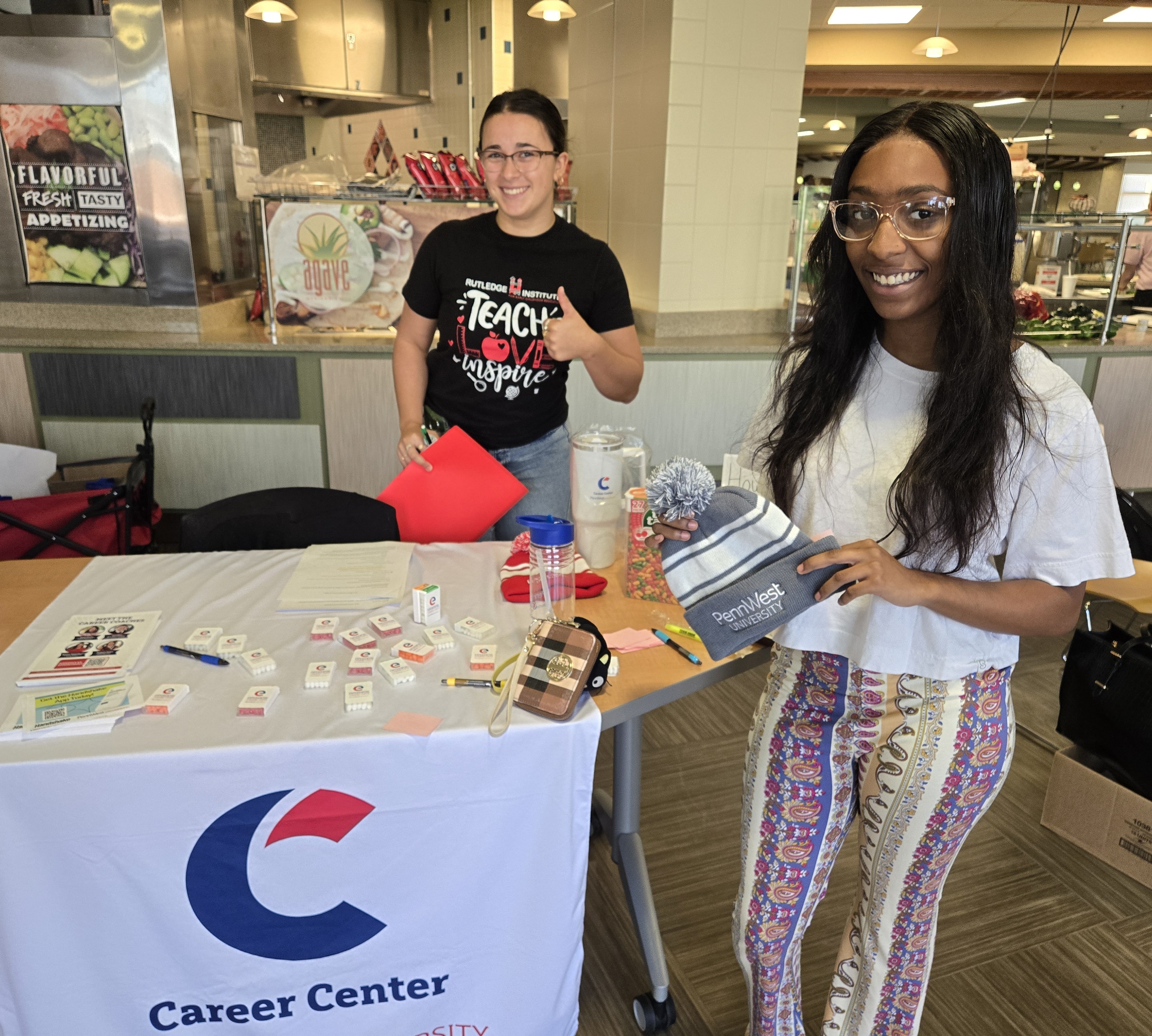 students at information table
