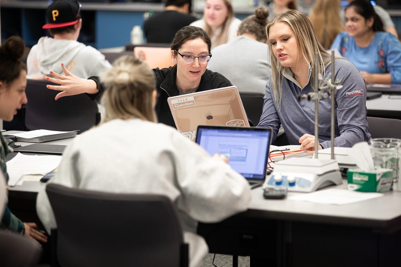 students with computers in a classroom