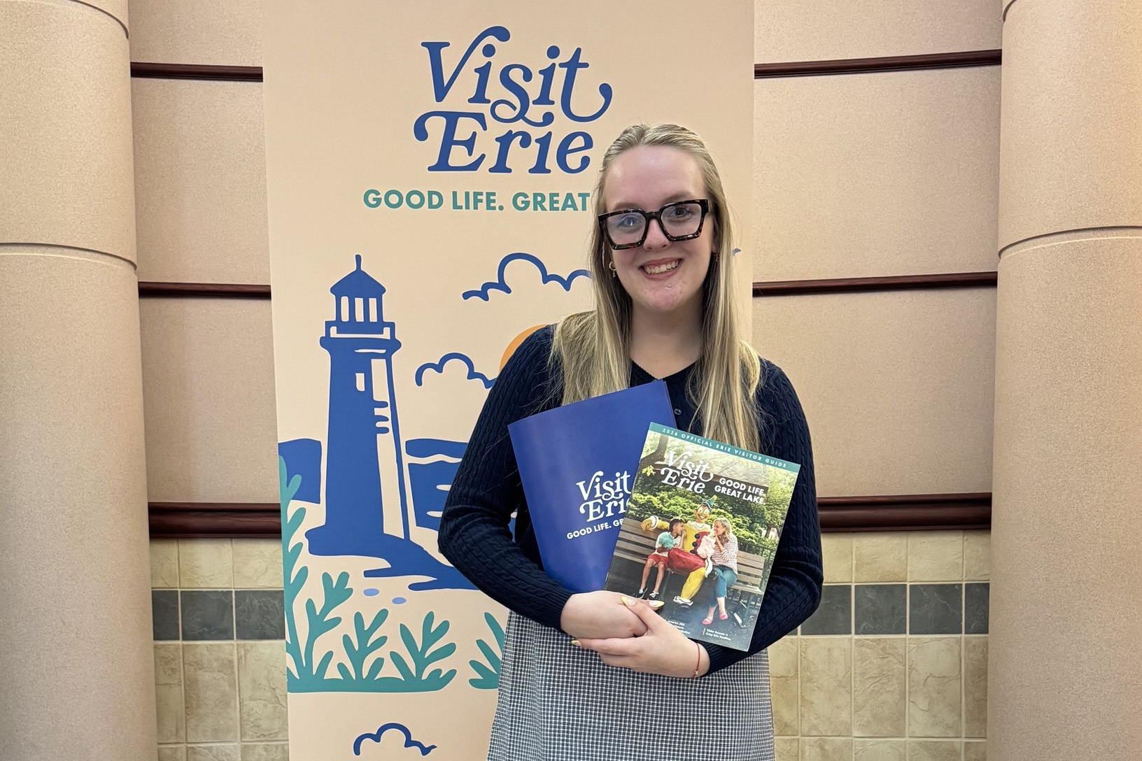 Alison Jones, a senior at PennWest Edinboro, poses for a photo during her internship at VisitErie