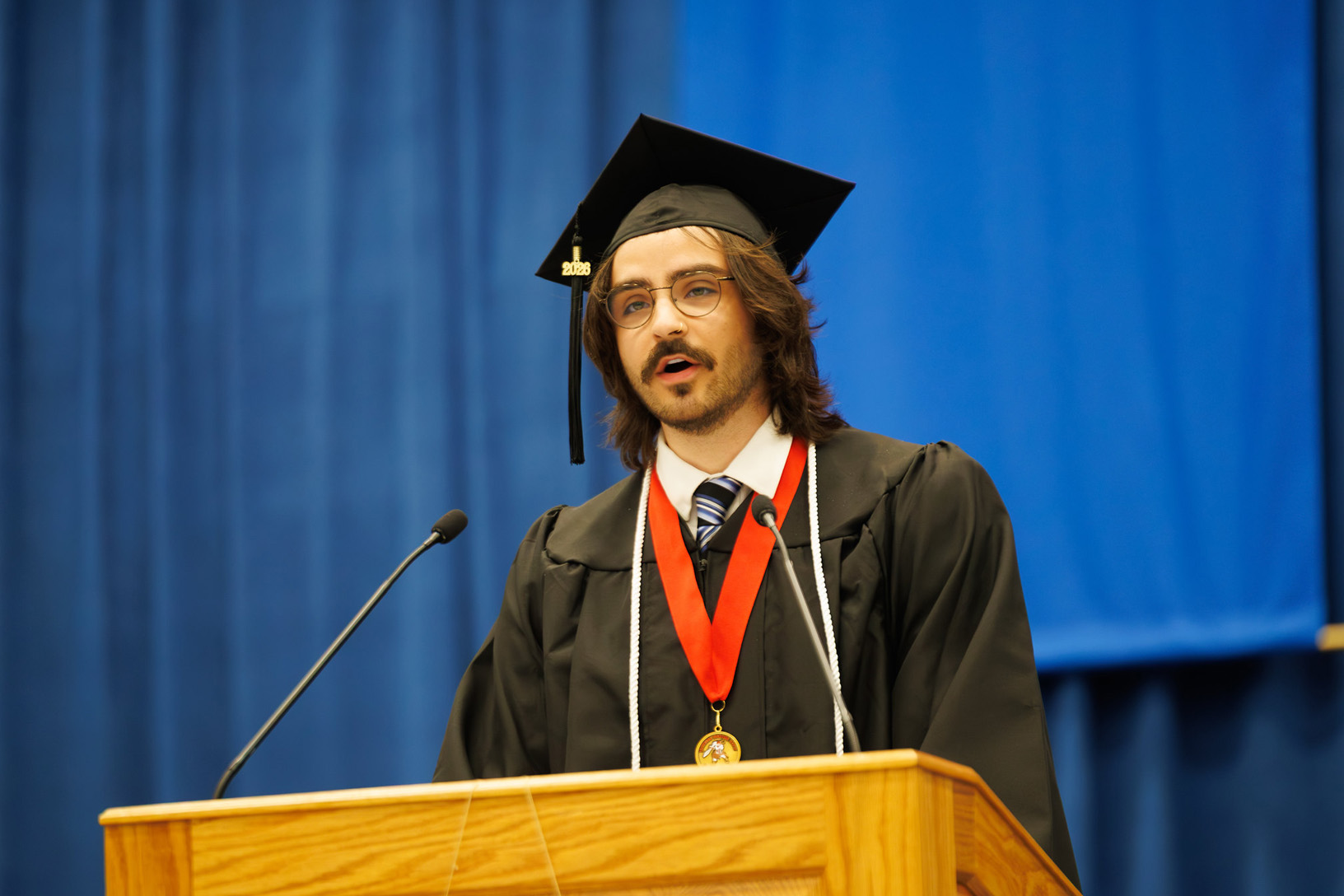 PennWest Clarion commencement speaker Karsten Kadylak stands at the podium during the spring commencement ceremony on May 9, 2026