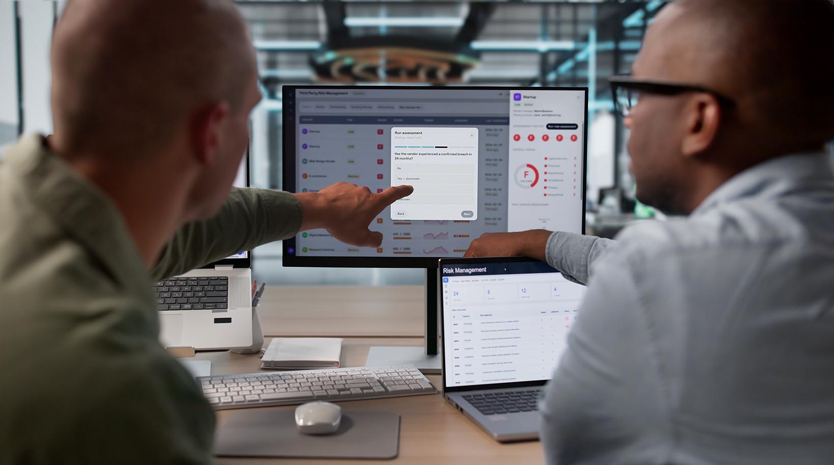 two people work at a computer