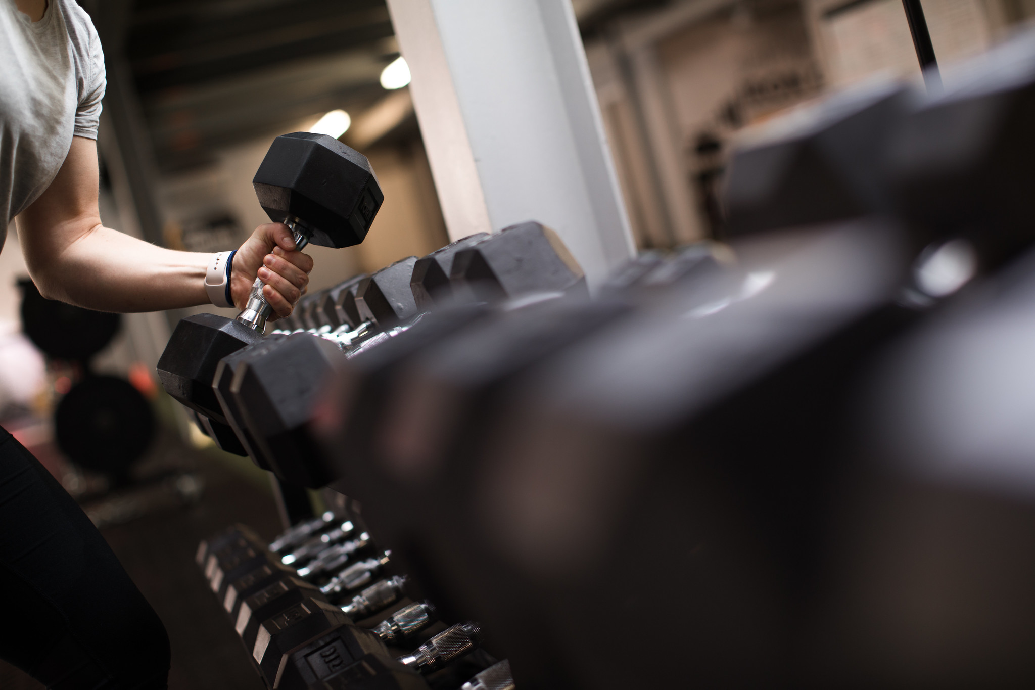 person lifting a dumbbell