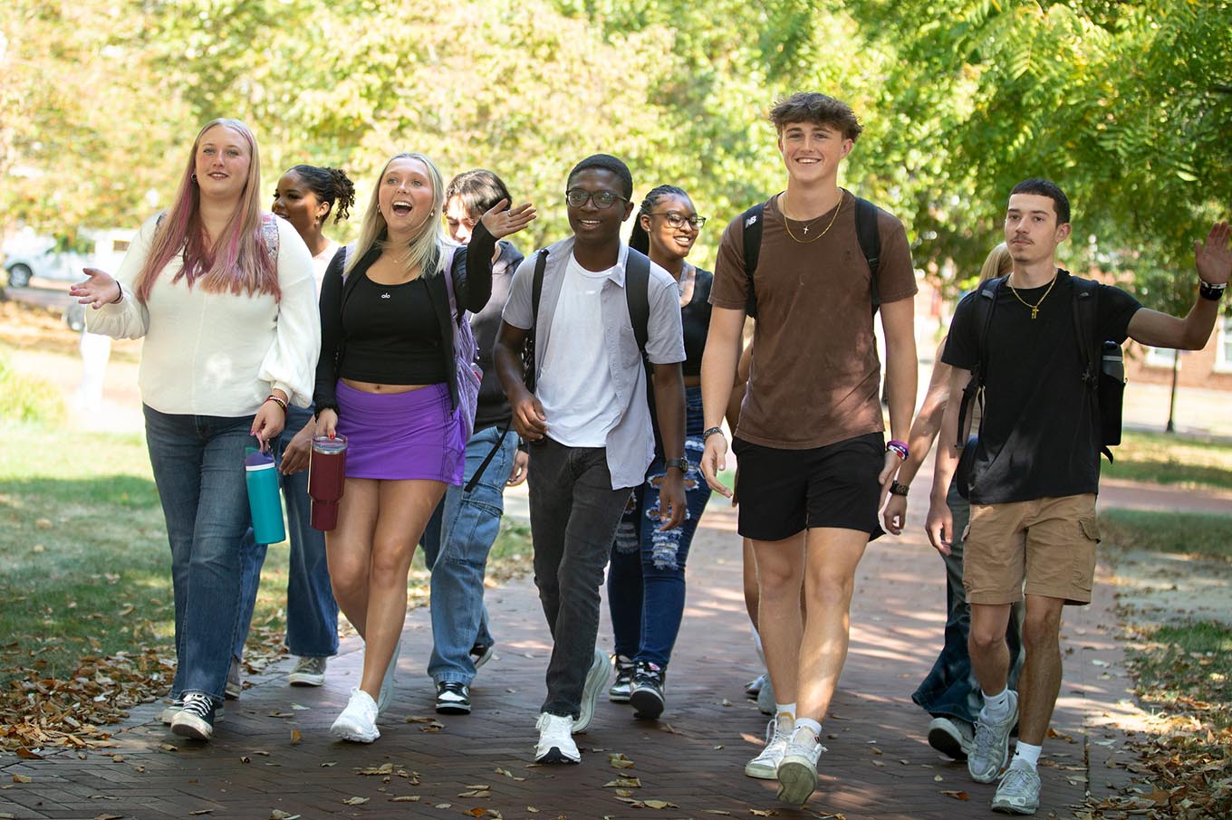 students walk across campus