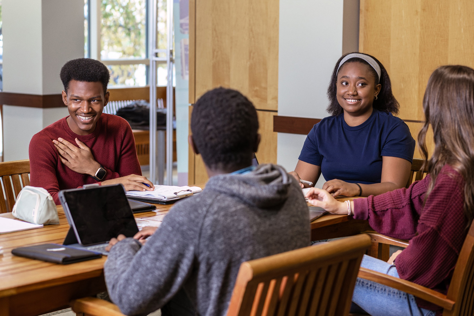 group of students sitting around a table